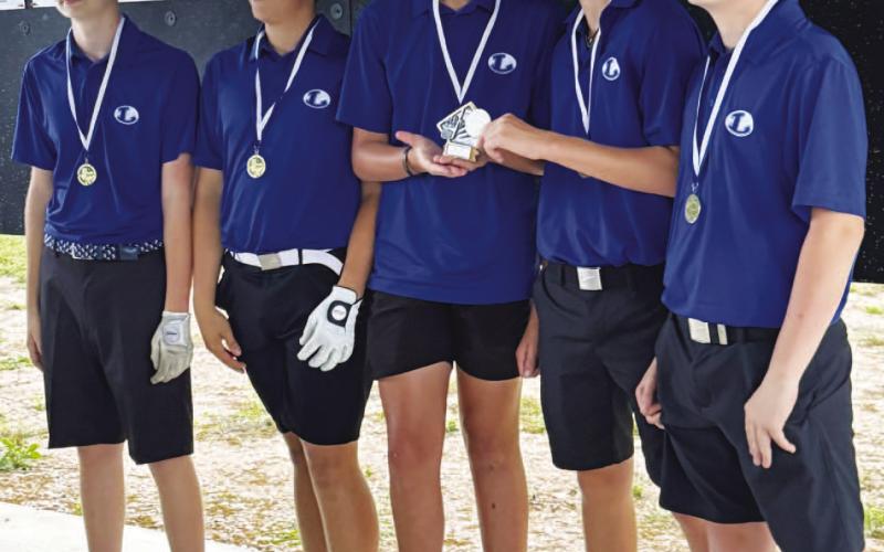 From left, Jem Moore, Noah Harrell, Henry Shahan, Brayden Brewer and Zane Nelson pose with their district championship trophy. COURTESY PHOTO