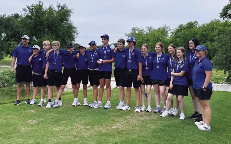Both the boys’ and girls’ middle school golf teams pose for a photo after finishing first and second, respectively, in the district tournaments last week. COURTESY PHOTO