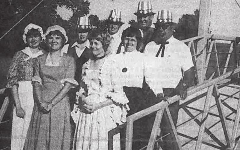 Posing on the suspension bridge in W.M. Brook Park are members of the 1976 Spring Ho Committee, from left: Bobbie Morris, chairman Mary Ann Roberson, George Herrmann, Wanda Cox, Robert Faught, Betsy Builta, Alton Berry and Fred Willis. Not present: Jack Baum and Gary Martin. The nation’s bicentennial was celebrated that fifth year of the festival. FILE PHOTO