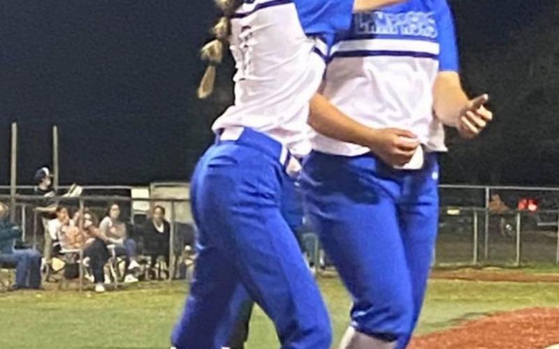 Kayli Syx, left, and Alycia Cantu celebrate Cantu’s two-run homer that drove in Syx at Georgetown Gateway Prep. JAMIE SYX | COURTESY PHOTO