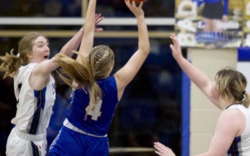 Taylor Allen (left) and Morgan Lovejoy defend against Lago Vista on Tuesday. JEFF LOWE | DISPATCH RECORD