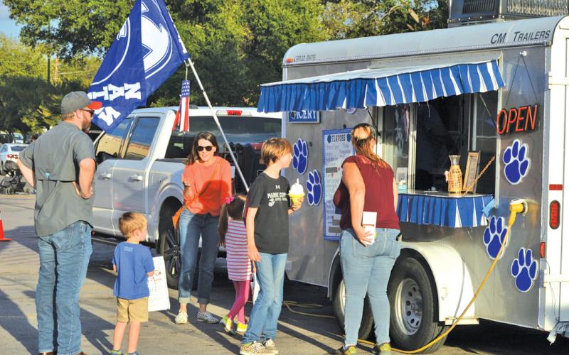 Lampasas residents line up at a snow cone truck during the 2023 National Night Out celebration. file photo