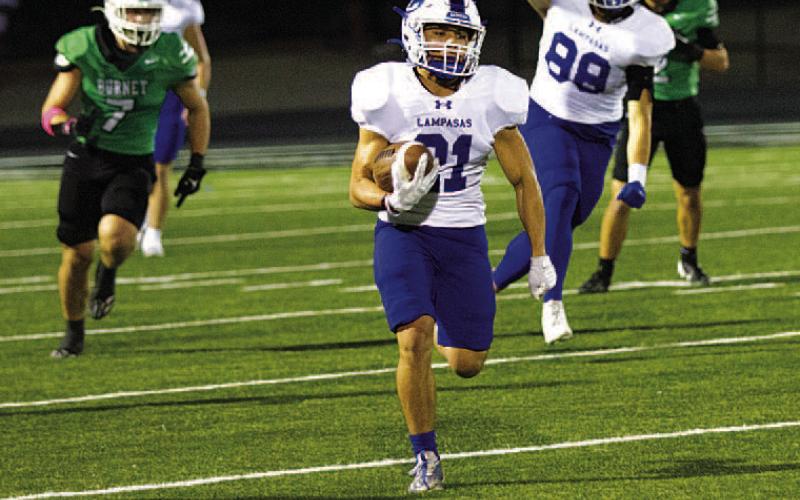 HUNTER KING | DISPATCH RECORD KJ Reed runs for a 72-yard touchdown as Bodhi Westra points to the sky.