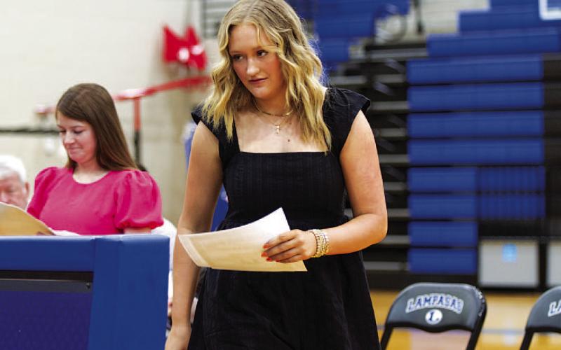 Keaton Owen walks to the front of the gym after receiving her recognition. HUNTER KING | DISPATCH RECORD