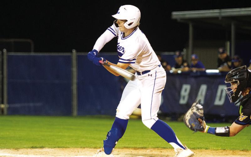 Rawlin Smith checks his swing during an at-bat late in the game. HUNTER KING | DISPATCH RECORD