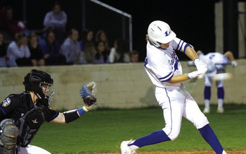 Timber Gholson hits a pitch for a single during the first inning of Tuesday’s game. HUNTER KING | DISPATCH RECORD