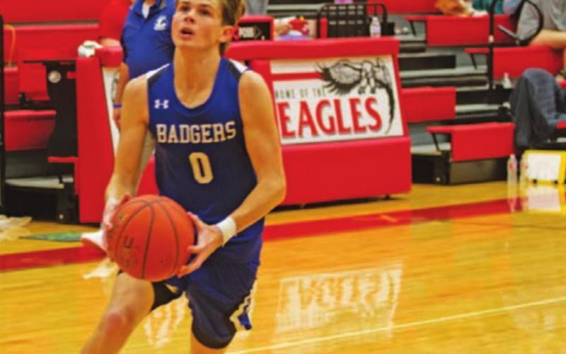 Nate Borchardt drives to finish a layup against Snyder last Friday. HUNTER KING | DISPATCH RECORD