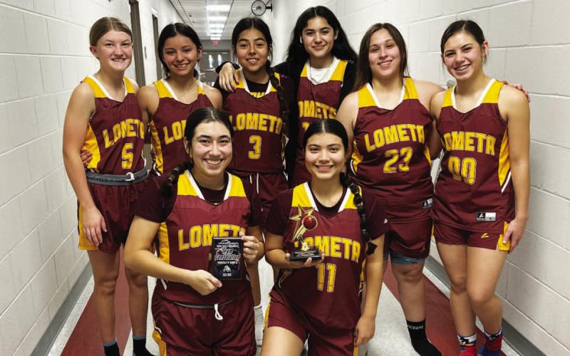 COURTESY PHOTO | FRANK REYES III The Lometa girls pose with their consolation trophy from the Zephyr tournament.