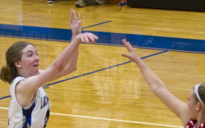 Taylor Allen knocks down a three-pointer from about 24 feet out to bring Lampaas within two points of Glen Rose. Later, she tipped in the game-tying basket at the end of regulation. JEFF LOWE | DISPATCH RECORD