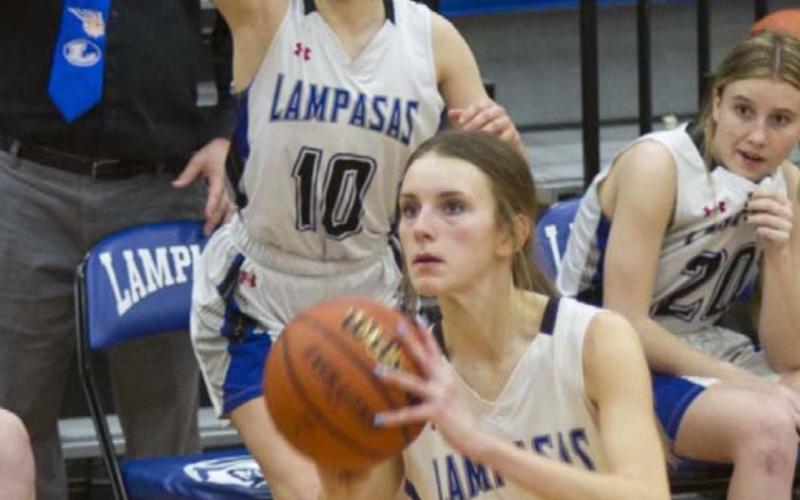 Addison McDonald shoots the game-winning three-pointer as her team watches in suspense: back row, left to right, coach Mark Myers, Bre Quarles and Cobie Chandler. JEFF LOWE | DISPATCH RECORD