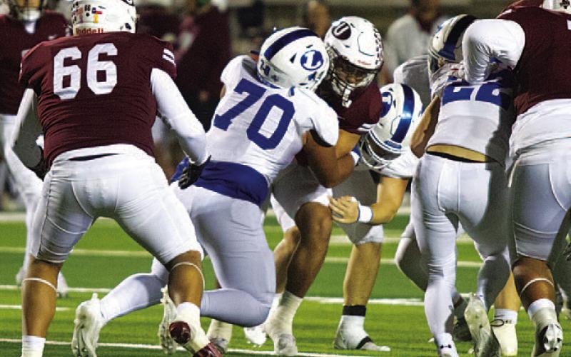 Cameron Russell makes a tackle during last week’s win over Uvalde. HUNTER KING | DISPATCH RECORD