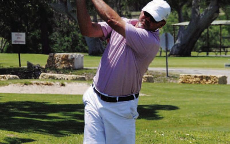 FILE PHOTO Mike White tees off at last year’s tournament.