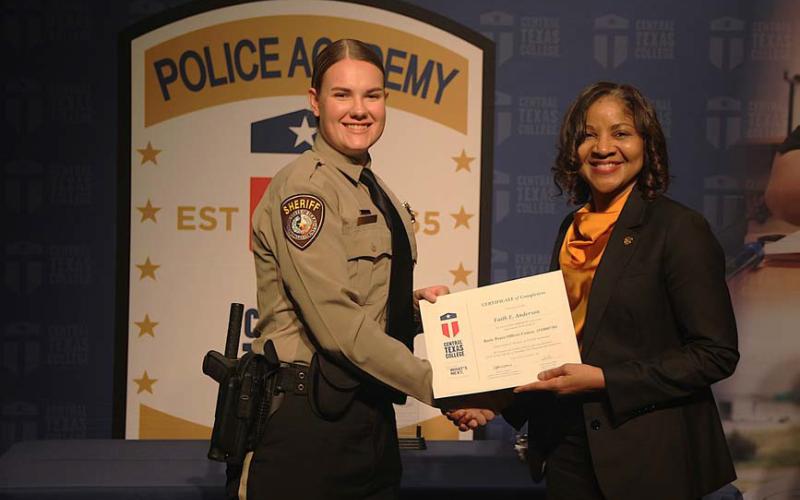 Central Texas College Police Academy Cadet Faith Anderson receives her graduation certificate from Central Texas College Chancellor Dr. Michele J. Carter. Anderson is the newest deputy at the Lampasas County Sheriff’s Office. COURTESY PHOTO