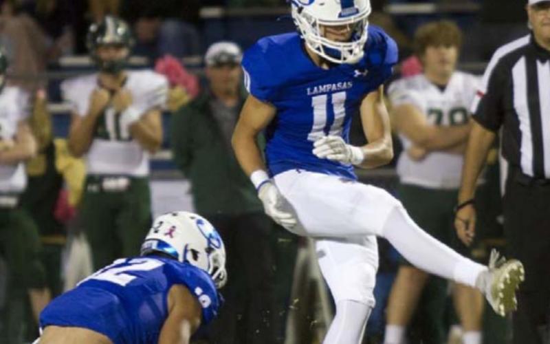 Landon Richardson puts his leg through a 34-yard field goal in the Canyon Lake game. HUNTER KING | DISPATCH RECORD