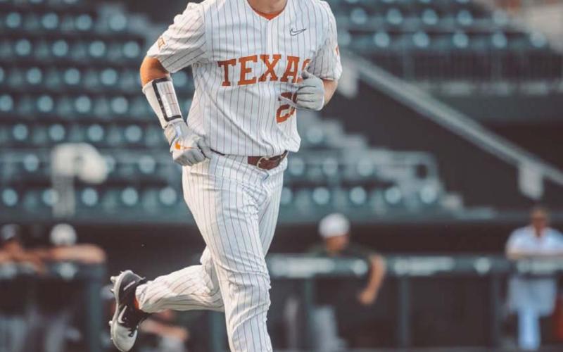 Ace Whitehead walks down to first base last Sunday after drawing a walk in one of his at-bats during the first fall scrimmage for the Longhorns. COURTESY PHOTO