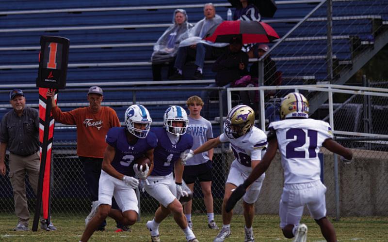 Tripp Stinnett evades Marble Falls defenders to get to the goal line for his touchdown. HUNTER KING | DISPATCH RECORD