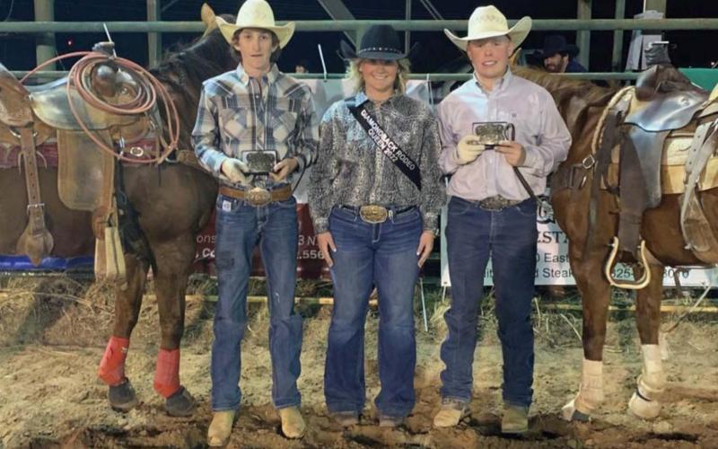 Buckle winners Pace Anastas, at left, and Dos Davison are shown with 2022 Miss Diamondback Jubilee Rodeo Queen Britni Roberts. Anastas, 14, of Mason was the header, and Davison, 15, of Lampasas was the heeler at the March 25 team roping event when they took fourth place. terri harris | courtesy photo