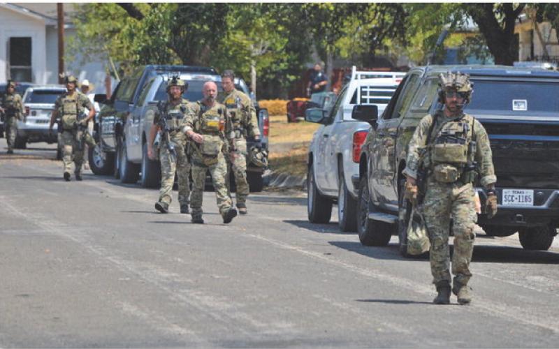 Multiple law enforcement agents, including a SWAT team sent by Texas DPS, assisted the Lampasas Police Department in securing the area near the Cameron Drive residence where retired Lampasas County sheriff Gordon Morris was reported to have shot his wife Thursday morning. ERICK MITCHELL | DISPATCH RECORD