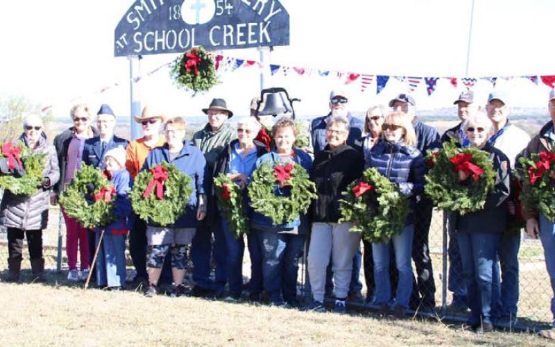 This group gathered at Smith Cemetery at School Creek to place Christmas wreaths on the graves of veterans buried there. ALICE CASBEER | COURTESY PHOTO