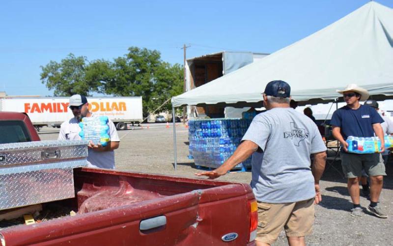 The city of Lampasas offered a water station near downtown on Saturday and Sunday to allow residents in need of potable and non-potable supplies to drive up and receive water during the Stage 5 emergency. Lampasas Fire Department and Lometa Volunteer Fire Department were on hand to assist with distribution. JM LOWE | DISPATCH RECORD