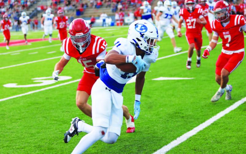 MICHAEL KUEHNE | KDIGITAL PRO Jaden McElwain gets away from a Fredericksburg defender during last Friday’s contest.