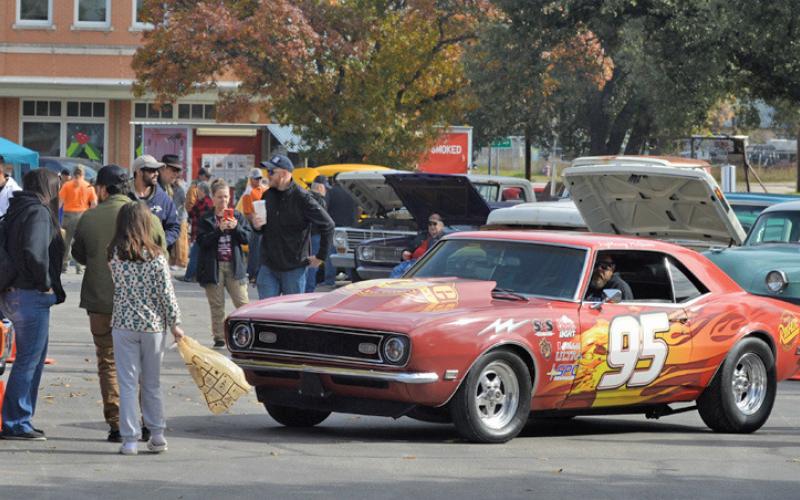 A vehicle with a Lightning McQueen paint scheme from the Disney film “Cars” was on display at Saturday’s car show on the courthouse square. ERICK MITCHELL | DISPATCH RECORD