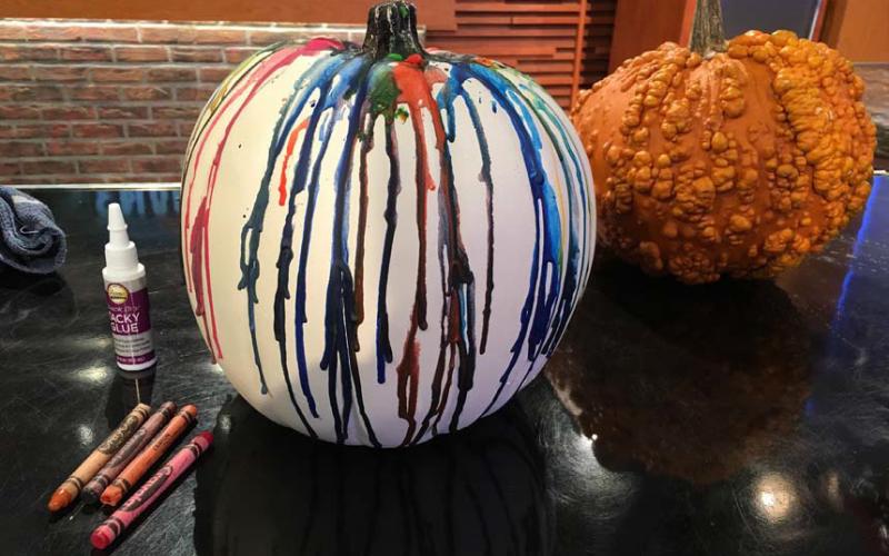 Extend the life of pumpkins by creating crayon-dripped decorations rather than carving them. photo | melindamyers.com