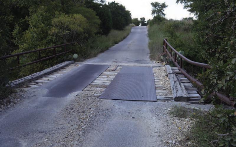 Work on this bridge over Little Lucy Creek in Precinct 3 has made the roadway passable, but County Commissioner Shad Hill still has plans to seek a replacement structure on County Road 2207. ERICK MITCHELL | DISPATCH RECORD