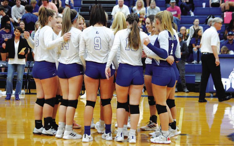 The volleyball team huddles before Tuesday’s game against Marble Falls. HUNTER KING | DISPATCH RECORD