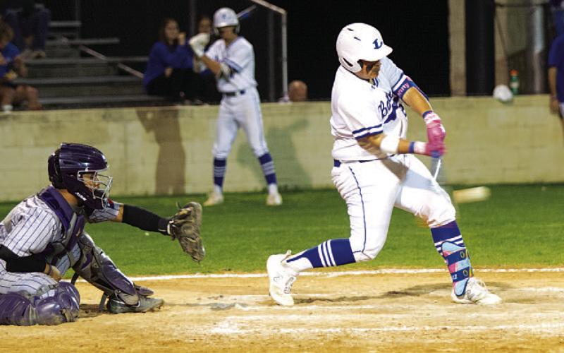 HUNTER KING | DISPATCH RECORD Benny Rodriguez swings at a pitch in Tuesday’s game against the Mustangs.