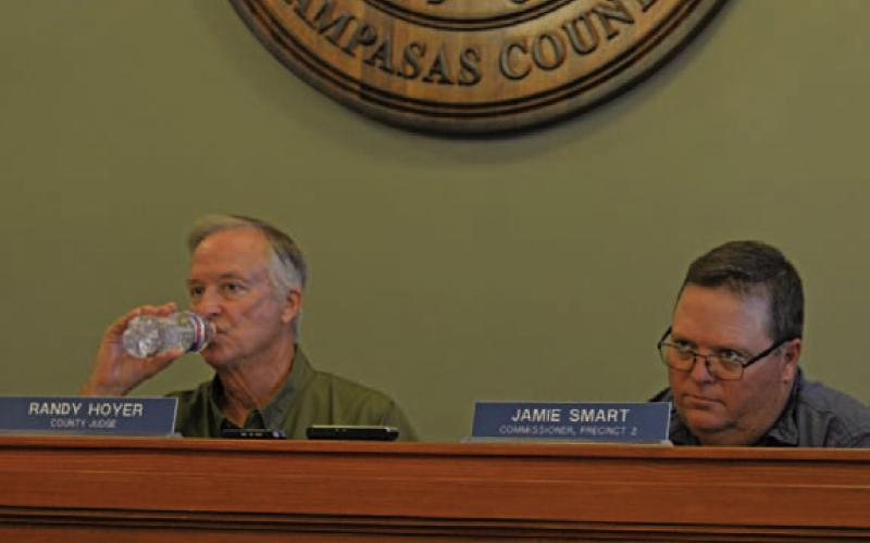 County Judge Randy Hoyer, at left, and Precinct 2 Commissioner Jamie Smart during Monday’s meeting. ERICK MITCHELL | DISPATCH RECORD