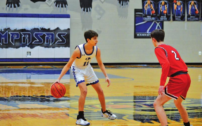 Luke Shivers dribbles and looks for a teammate to pass to during the Badgers’ game against Salado last week. HUNTER KING | DISPATCH RECORD
