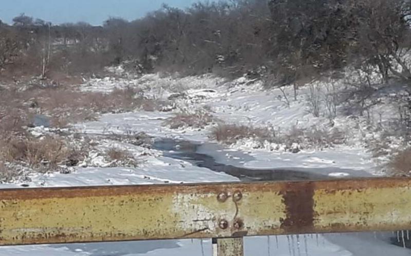 A partially frozen Mesquite Creek just south of Lampasas on U.S. Highway 183 is pictured during the stretch of extreme weather from Feb. 9-19, 2021, when the mercury stayed below 32 degrees for 10 consecutive days. FILE PHOTO