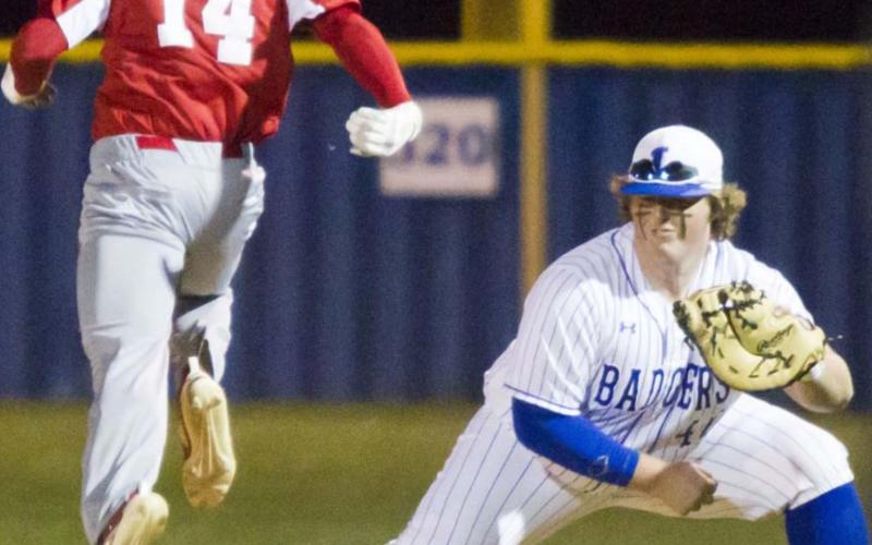 Senior first baseman Hayden Waldrip steps on first to force an out in a district game against Glen Rose during a three-game winning streak that ended on Monday. JEFF LOWE | DISPATCH RECORD