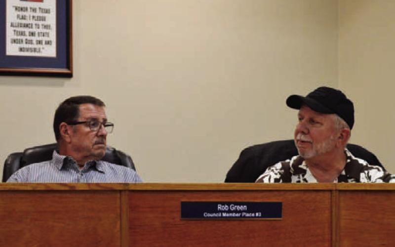Councilmen Rob Green, left, and Thomas Combs discuss the proposed 2026-2027 budget for the city of Kempner. Elimination of a setaside for a future municipal court judge salary has enabled the Kempner City Council to lower the tax rate for the upcoming year. ERICK MITCHELL | DISPATCH RECORD