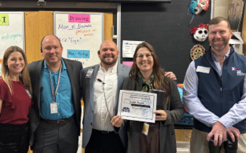 Also named Teacher of the Month for November is Judith Brown, whom Assistant Principal Ryan Race described as the high school’s “rock star teacher of the arts,” who makes “great connections with all her students in a positive, fun and professional manner.” Pictured presenting Brown her certificate are, from left, Assistant Principal Kristin Montague, Principal Paul Weinheimer, Race and Clay Phillips of Texas Farm Bureau Insurance. COURTESY PHOTO