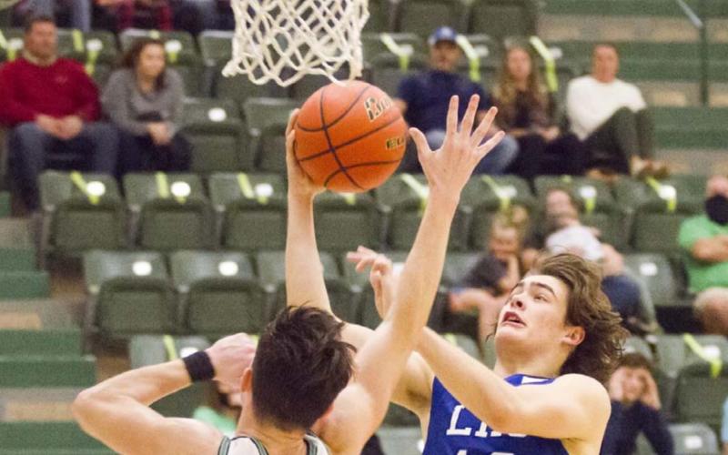 Landon Mulcahy (12) scored nine points in the fourth quarter in a close win over Burnet. JEFF LOWE | DISPATCH RECORD