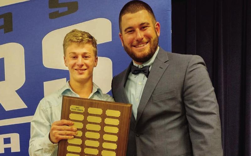 Isaac Abken, left, holds the Battlin’ Badger award next to head coach Samuel Burnside. COURTESY PHOTO | SAMUEL BURNSIDE