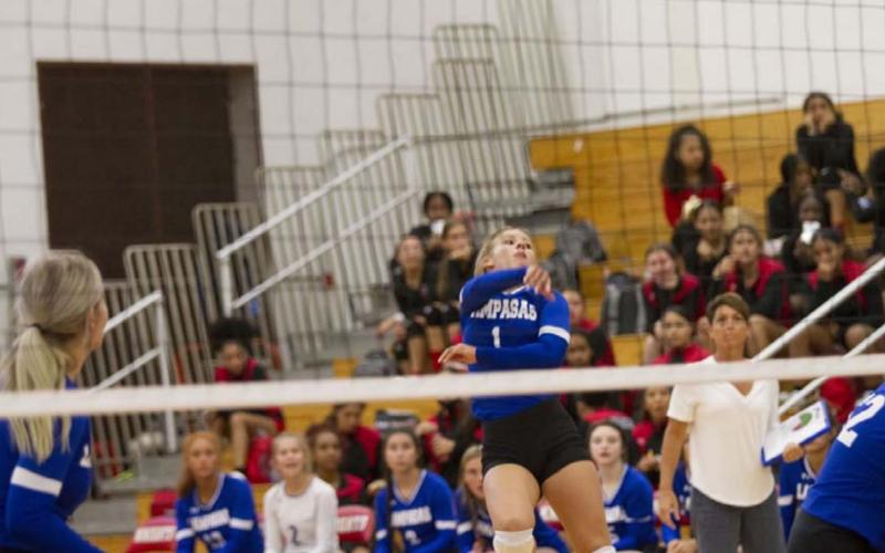 BreAnna Quarles finishes on a spike during the Lady Badgers’ first game against Harker Heights. HUNTER KING | DISPATCH RECORD