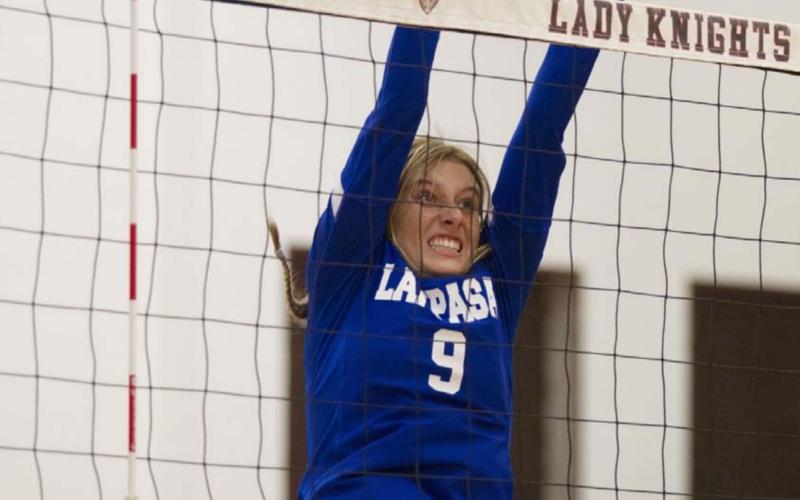 Cobie Chandler goes up for a block during the Lady Badgers’ match against Harker Heights. HUNTER KING | DISPATCH RECORD