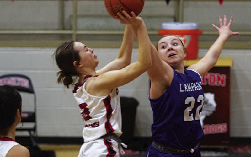 Kenedi Smart blocks a shot during the second half of Tuesday’s game. HUNTER KING | DISPATCH RECORD
