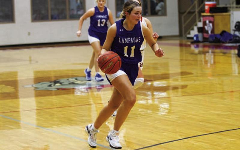 Mia Mulcahy dribbles down the court against Hamilton. HUNTER KING | DISPATCH RECORD