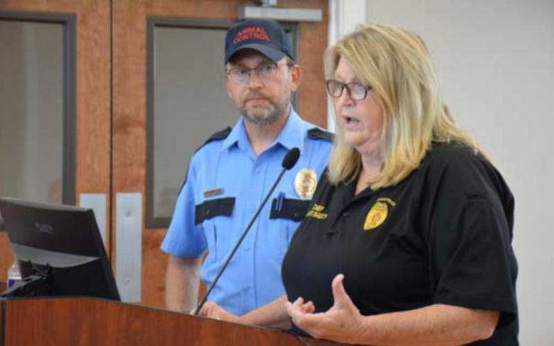 Chief of Police Sammy Bailey speaks about a proposed livestock and fowl ordinance that will be presented soon to the Lampasas City Council for consideration. Animal Control Officer Joe Schwartzer, background, also spoke at Monday’s council meeting. MONIQUE BRAND | DISPATCH RECORD