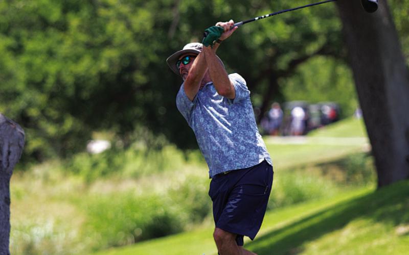 HUNTER KING | DISPATCH RECORD Shane Baxter tees off on the first hole at Hancock Park Golf Course.
