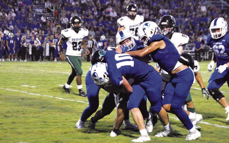 A host of Badgers including Brock Langford (10) are in on a tackle for loss. HUNTER KING | DISPATCH RECORD