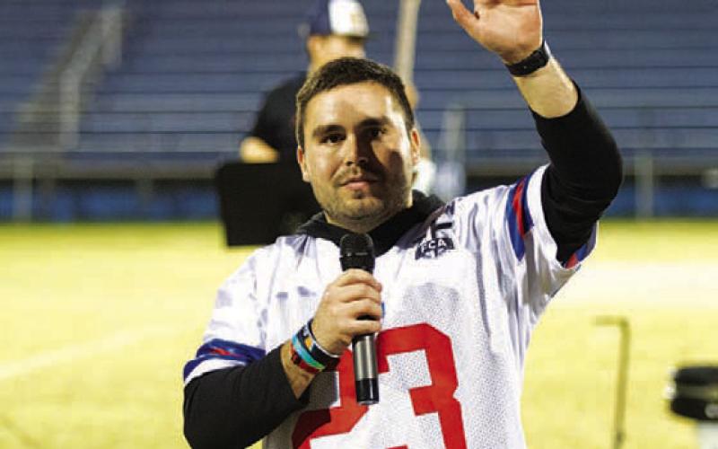 FCA coordinator Jaden Napolez addresses the crowd on Wednesday in the middle of the annual gathering. HUNTER KING | DISPATCH RECORD