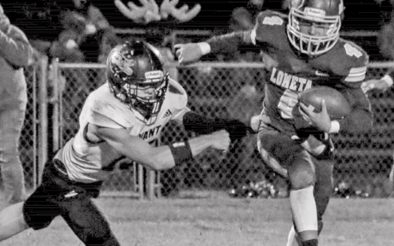 Tim Juarez evades an Evant defender during district play. MEGAN LUSTY PHOTOGRAPHY | COURTESY PHOTO