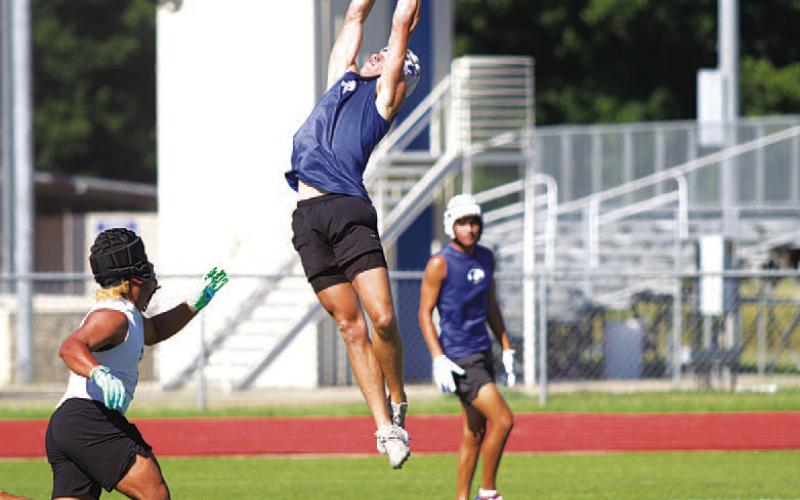 HUNTER KING | DISPATCH RECORD Jonathan Bowling and the Badgers competed in 7-on-7 in the heat of the day Wednesday.