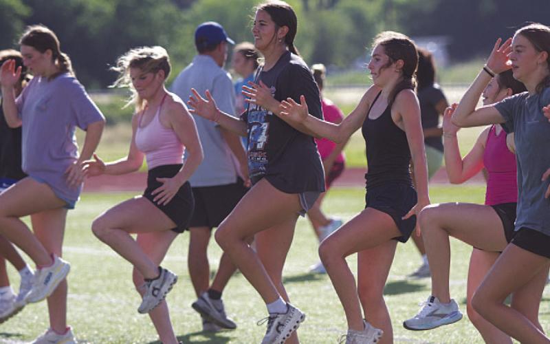HUNTER KING | DISPATCH RECORD Lady Badgers push through SWAT workouts that take place in the morning during the summer.