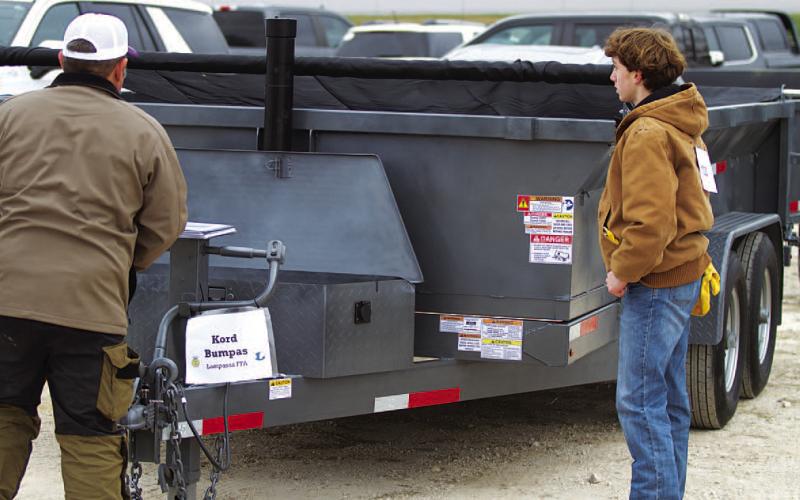 Kord Bumpus displays his 7-foot by 4-foot trailer at the Lampasas County Youth Livestock Show before judging, when he earned reserve grand champion honors. Bumpus said the trailer took more than 200 hours to complete. HUNTER KING | DISPATCH RECORD